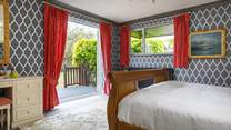Double doors open to the decking and garden.