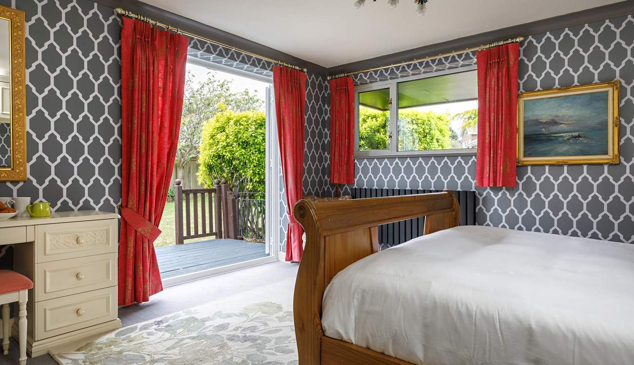 Double doors open to the decking and garden.
