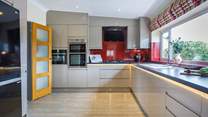 Rustle up a culinary delight in this fully equipped kitchen.