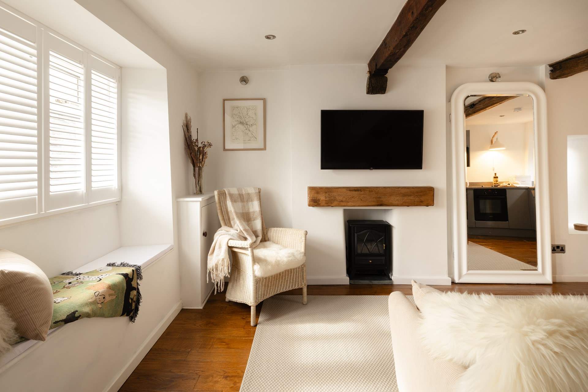 The plantation shutters let the dappled sunlight in.