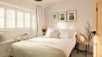 The double bedroom lets the light flood in.