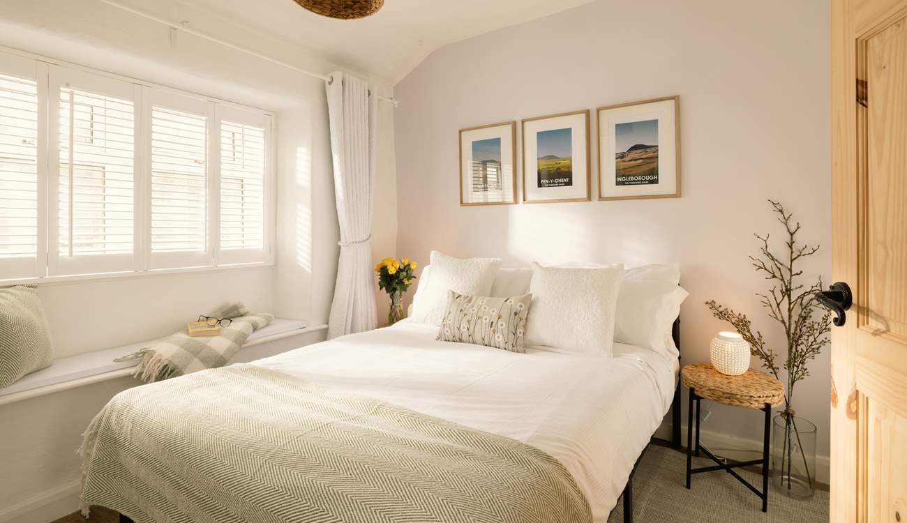 The double bedroom lets the light flood in.