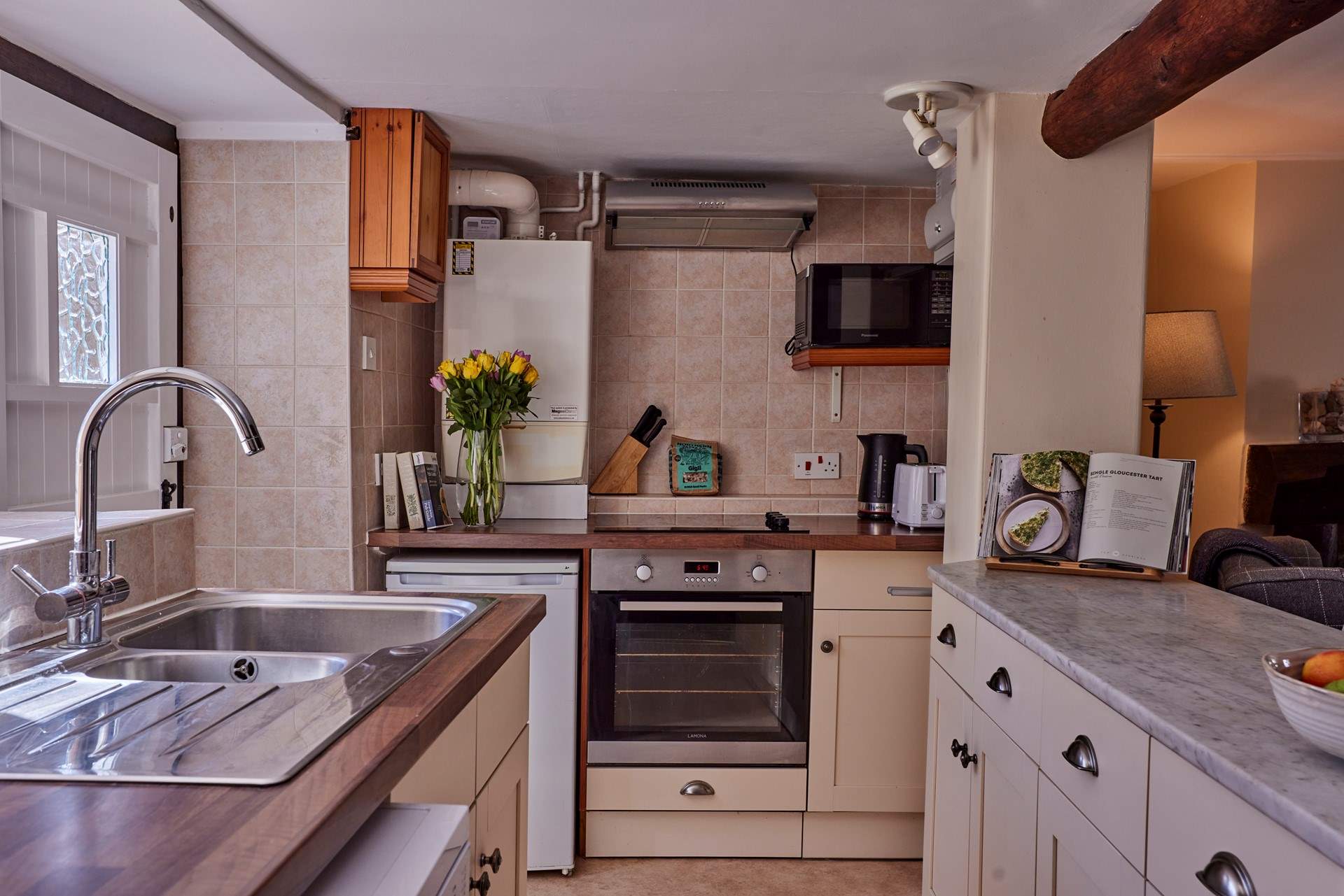 The galley kitchen is perfectly formed and has views over the garden - a real treat.