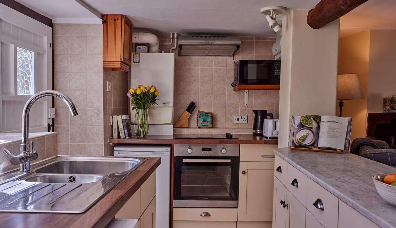 The galley kitchen is perfectly formed and has views over the garden - a real treat.