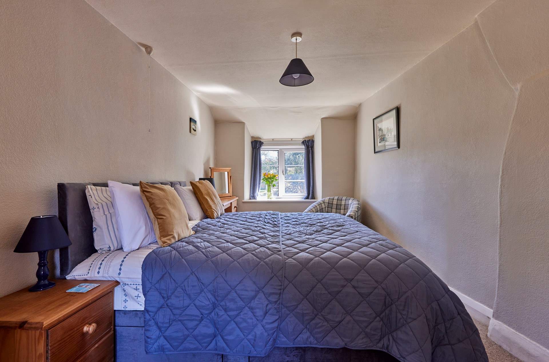 Both bedrooms are characterful and full of charm with lovely views out over the garden.