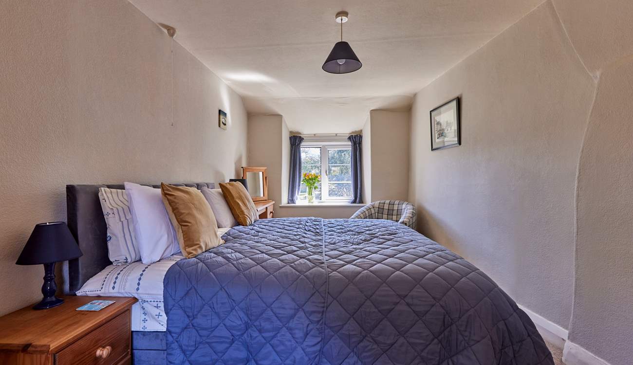 Both bedrooms are characterful and full of charm with lovely views out over the garden.