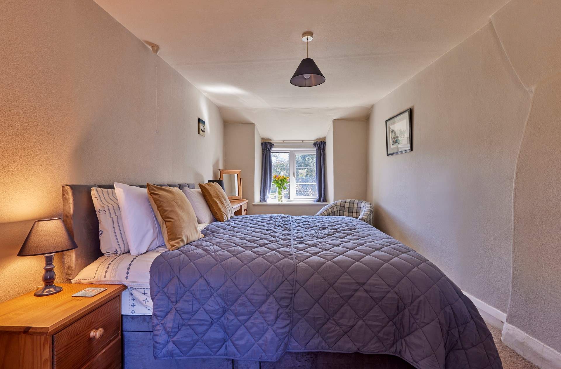 The main bedroom is very large with a sumptuous super-king size bed (which can be split into two singles) and lovely original features. Open the window and let the scents of spring and summer drift through whilst you have a well deserved lie-in.