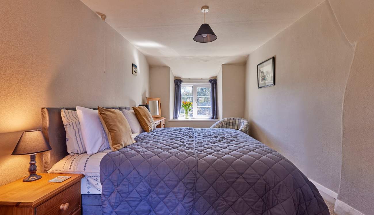 The main bedroom is very large with a sumptuous super-king size bed (which can be split into two singles) and lovely original features. Open the window and let the scents of spring and summer drift through whilst you have a well deserved lie-in.