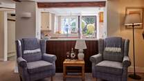 The semi open plan living-room is so peaceful and perfect for some quiet time with a glass of something nice and the sound of birdsong from the garden.