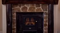 The log-effect electric fire makes the living space so cosy.