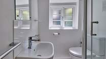 The shower-room is bright and modern with a lovely power shower.