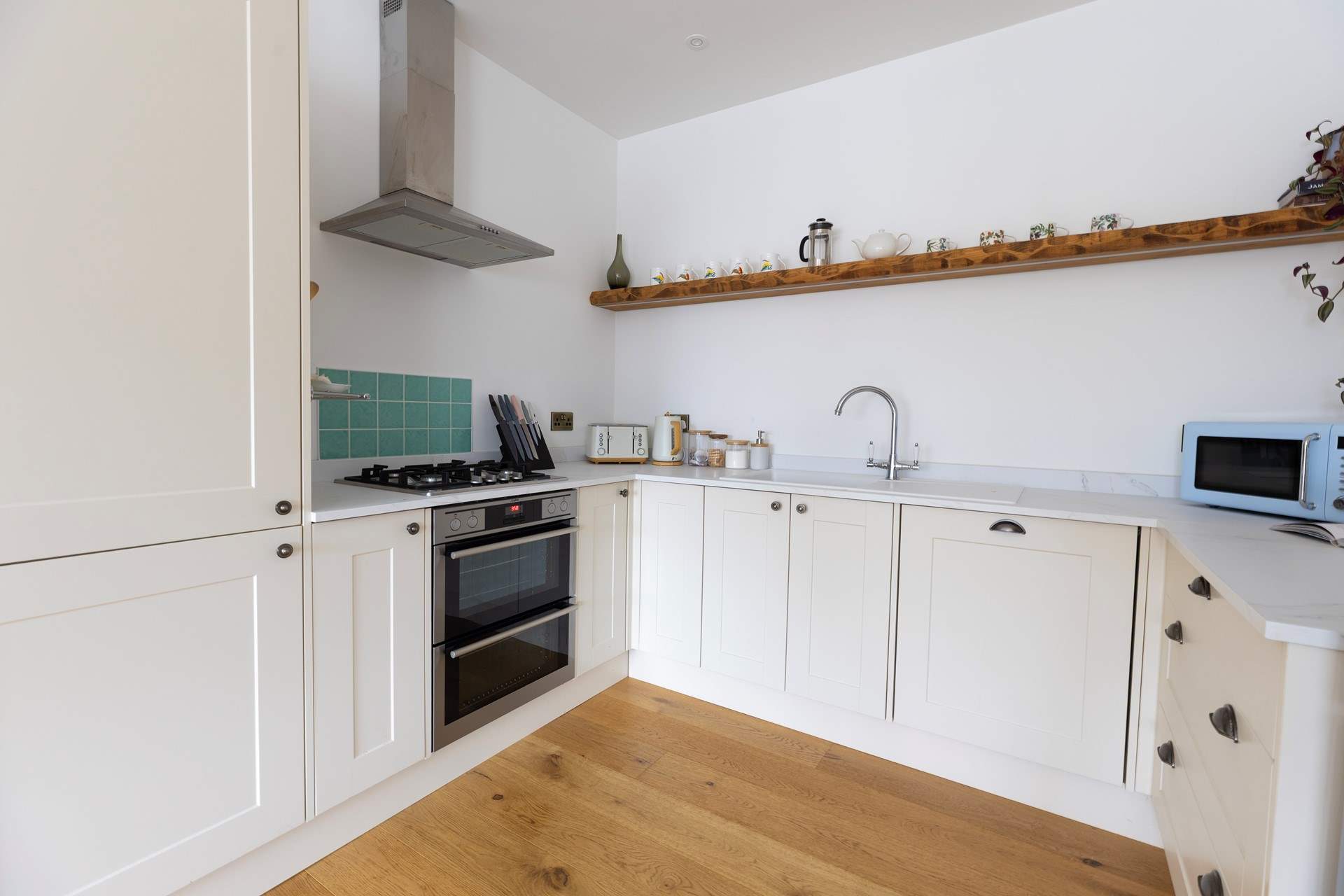 The light and bright kitchen has everything you might need. 