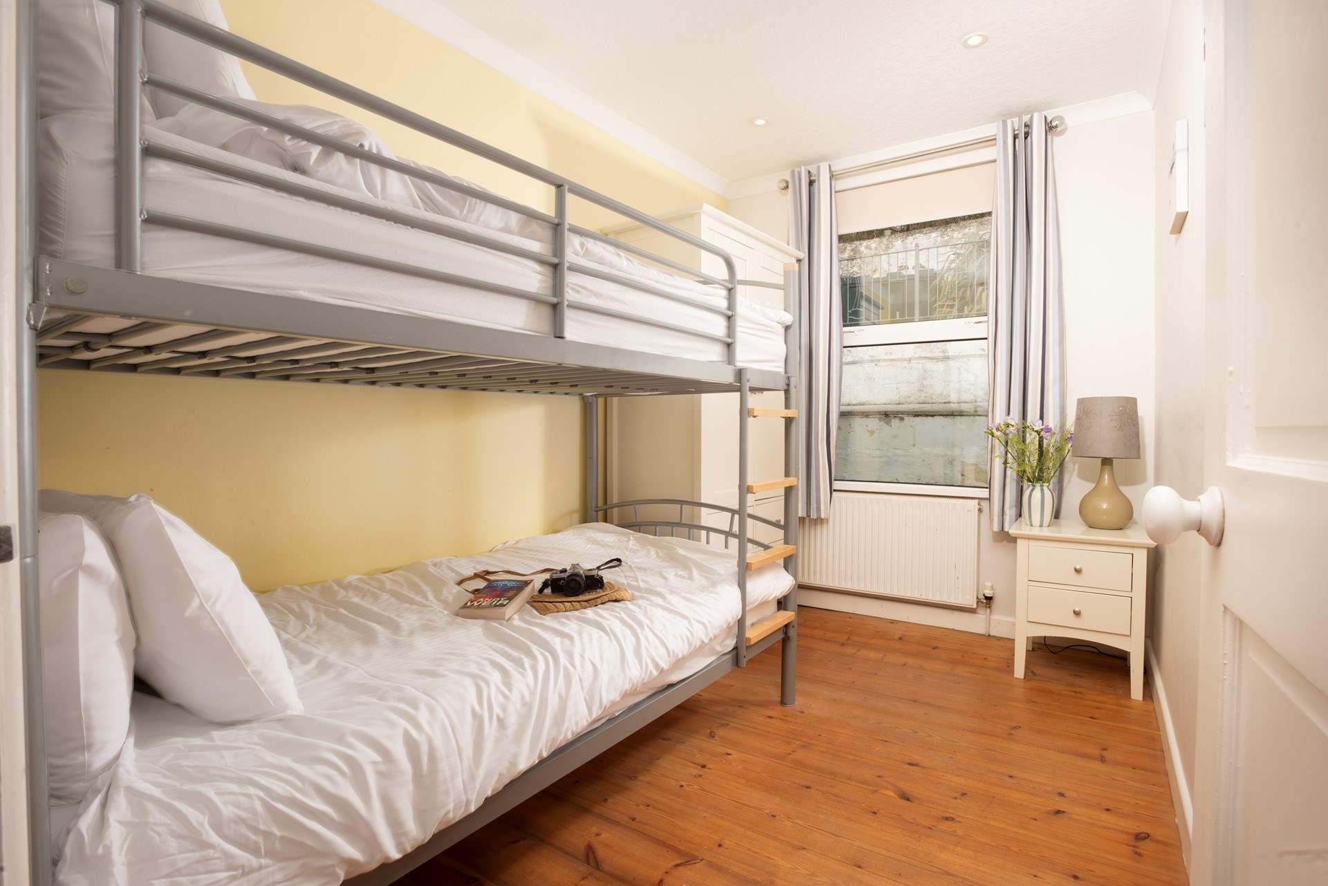 Cosy bunk-beds in the second downstairs bedroom.