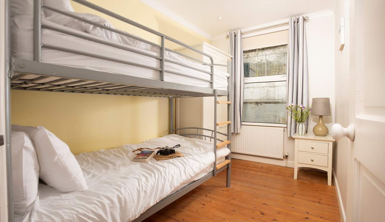 Cosy bunk-beds in the second downstairs bedroom.