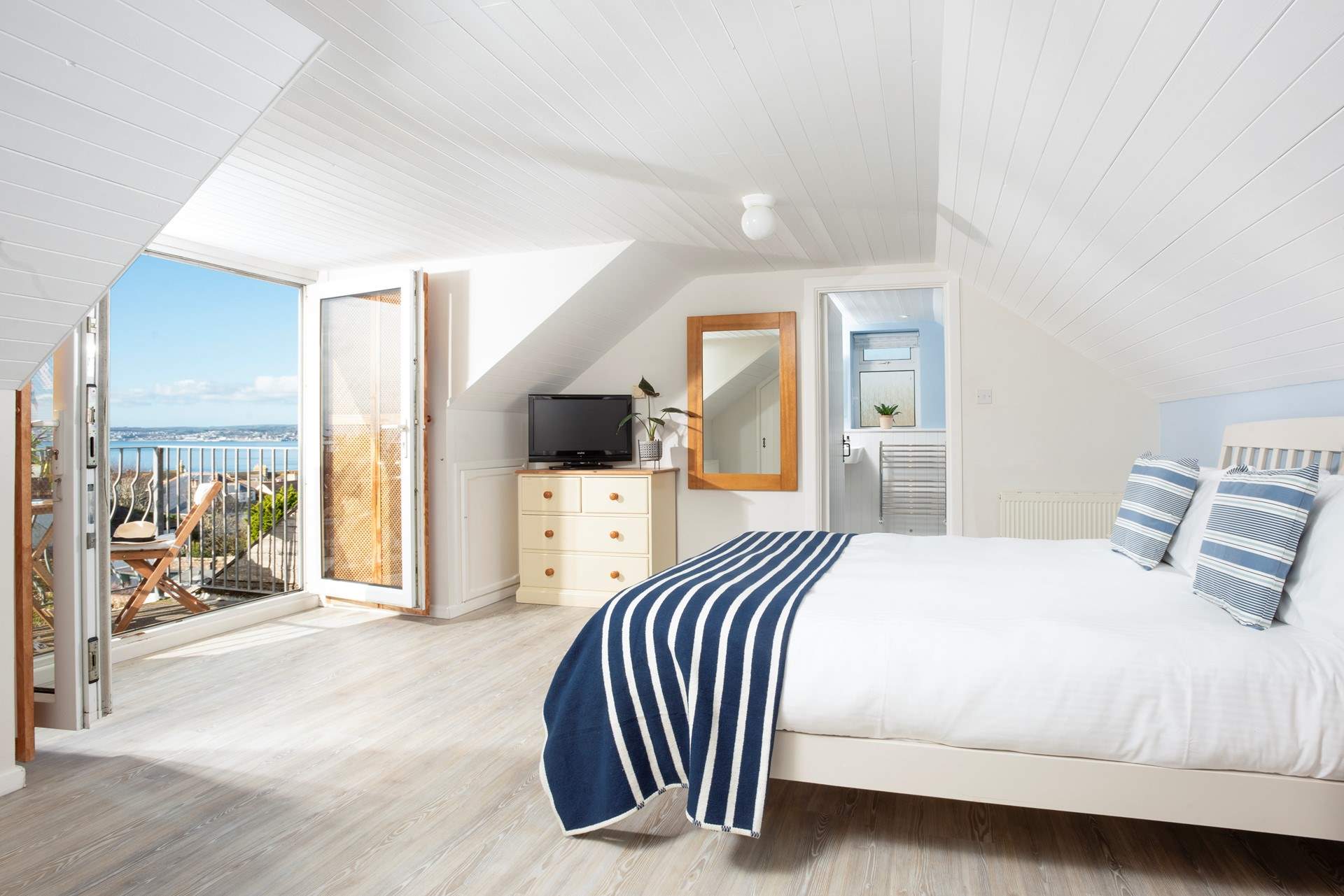 Wake up in king-size bedroom 3 where sea views greet you each morning.
