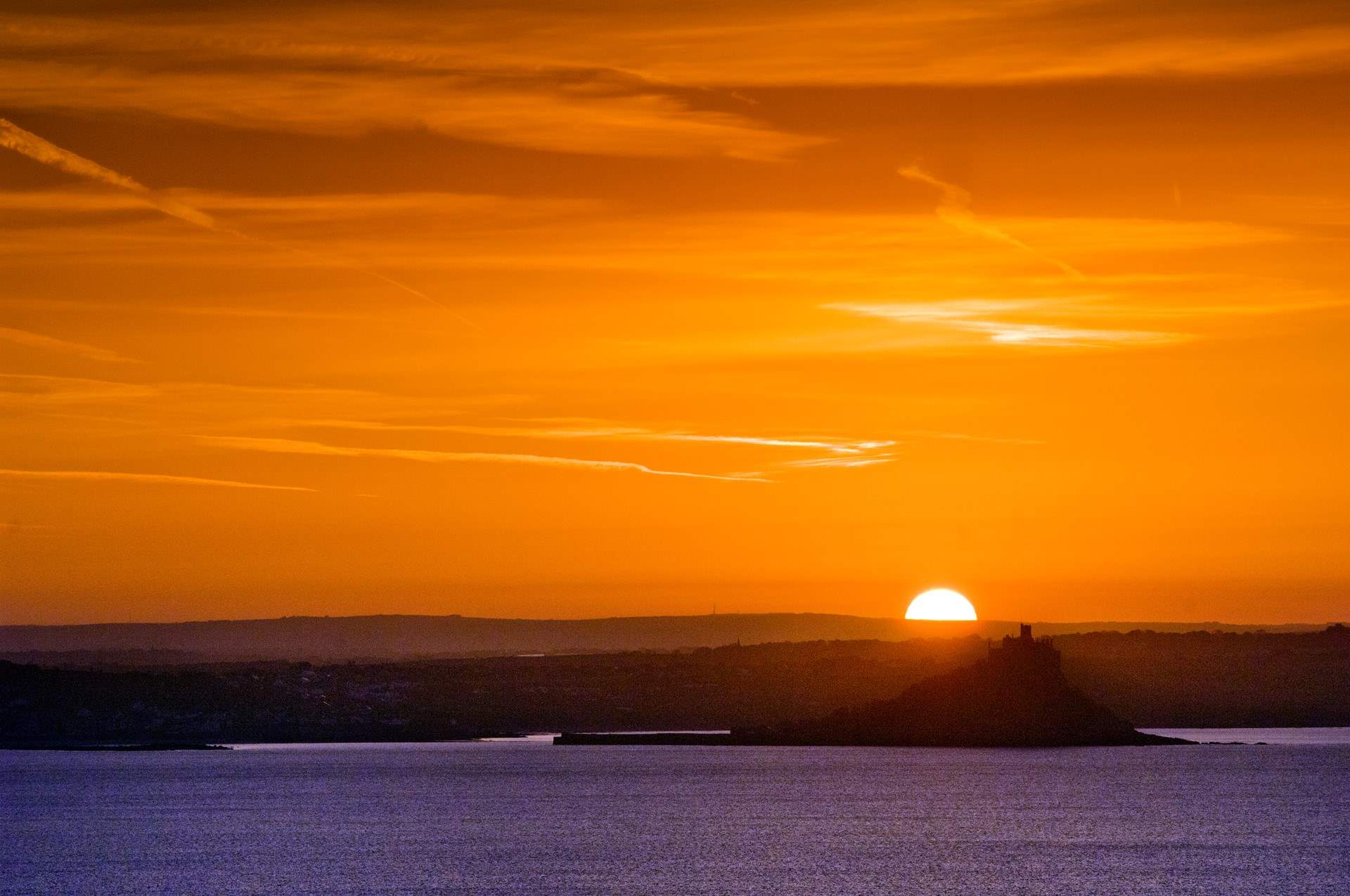 Watching the sun sink behind the castle.