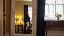 Opulent furnishings with luxurious linens. 