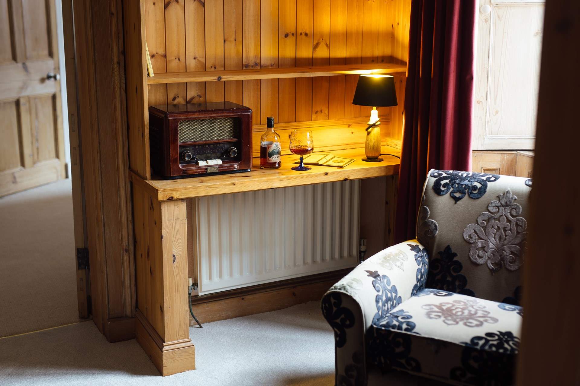 Take time out on the landing with a tipple and a good book. Look beyond the turrets across to the Clwydian Hills. 