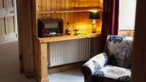 Take time out on the landing with a tipple and a good book. Look beyond the turrets across to the Clwydian Hills. 