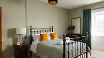 Choose from four double en suite bathrooms. Facing the front of the house, look across to the scenic views. 
