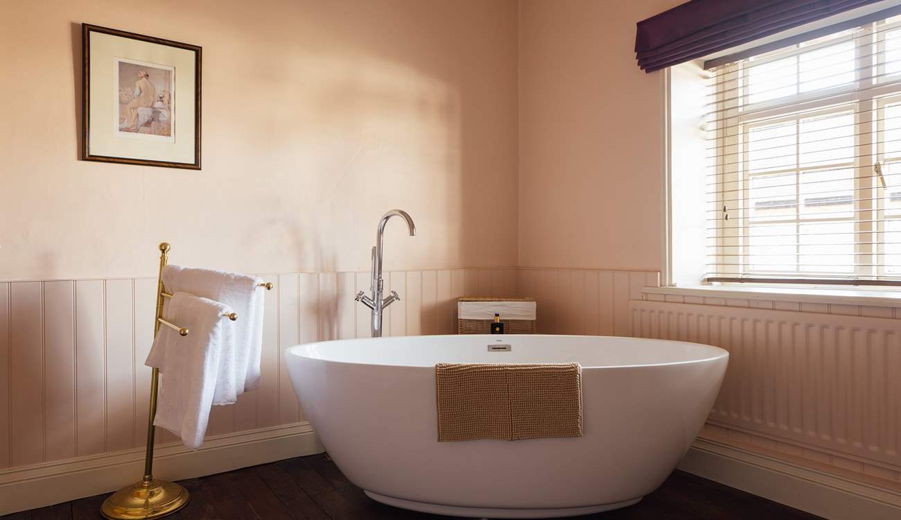 Luxurious, deep bubbly bath in the family bathroom. 