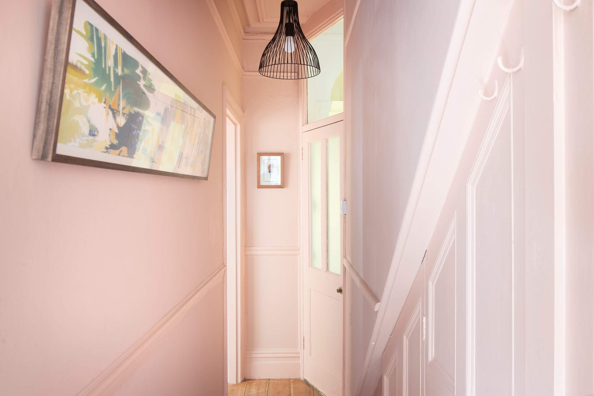 The fabulous pink entrance hall is such a warm welcome. 