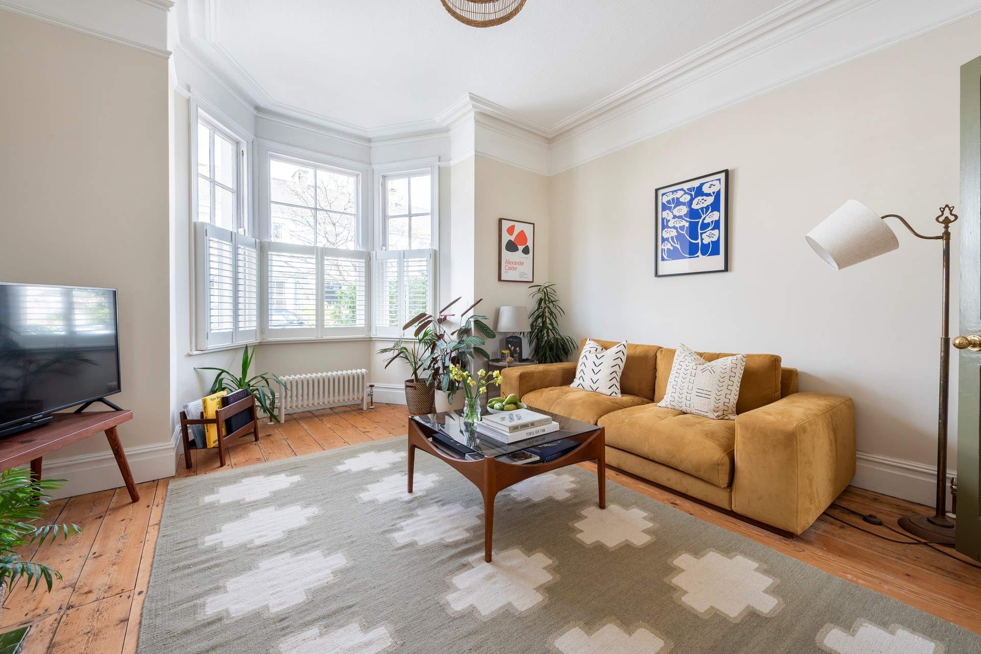 The large bay window allows light to flood into this room. 
