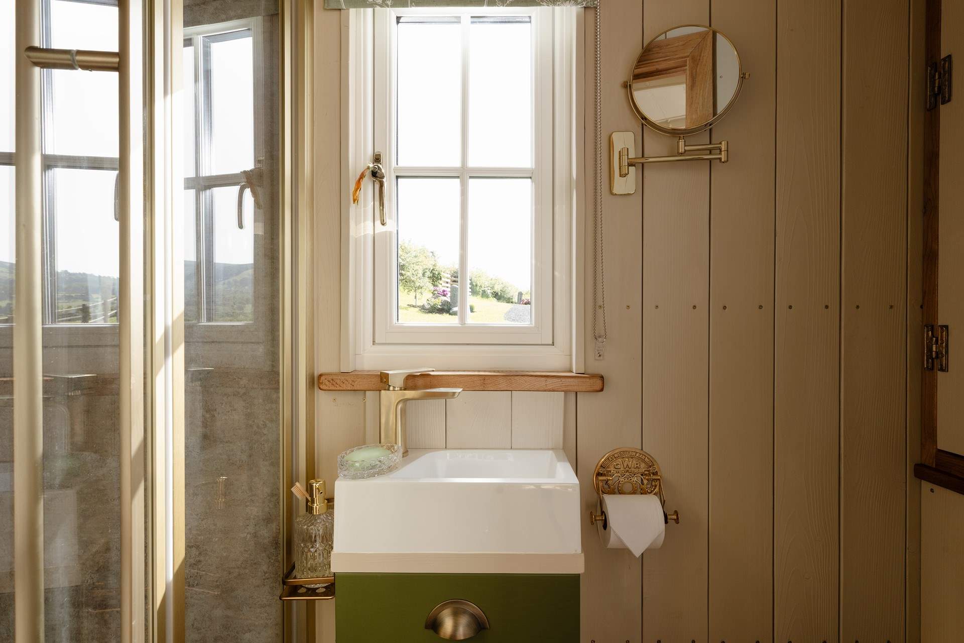 The light-filled bathroom offers a calming space to refresh.
