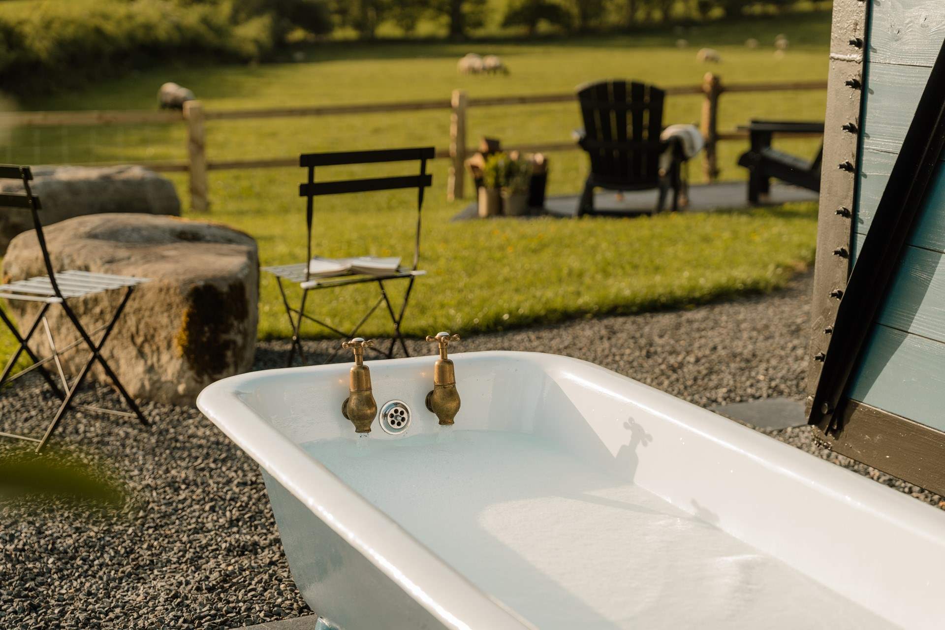 Hidden beside the wagon, an Edwardian roll-top bath offers a wonderfully indulgent spot for long soaks beneath starry skies.
