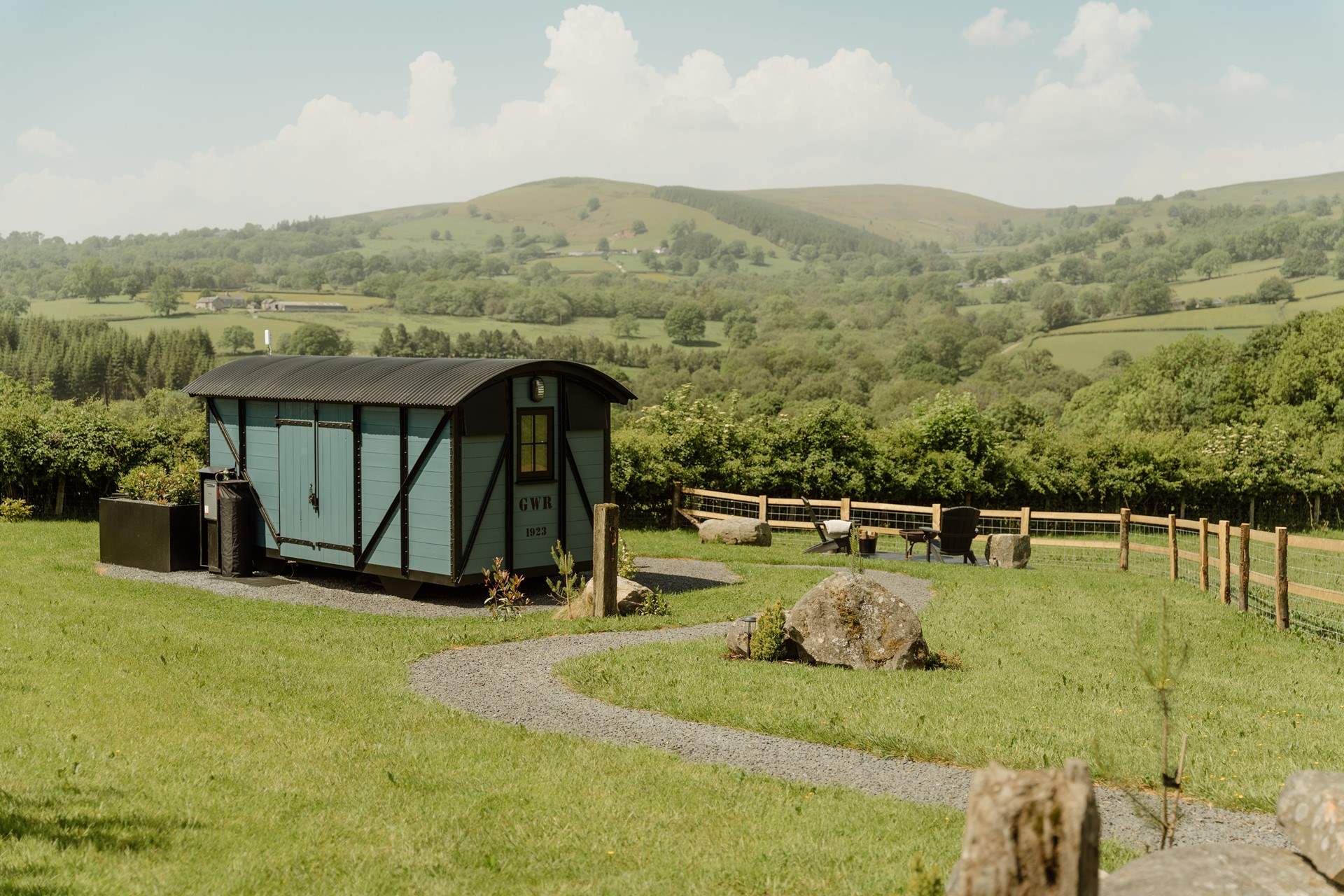 Seren - A railway wagon in Powys with an alfresco bath: From soaking beneath the stars in the outdoor bath to wandering through meadows alive with wildlife, Seren promises a truly restorative stay surrounded by nature.