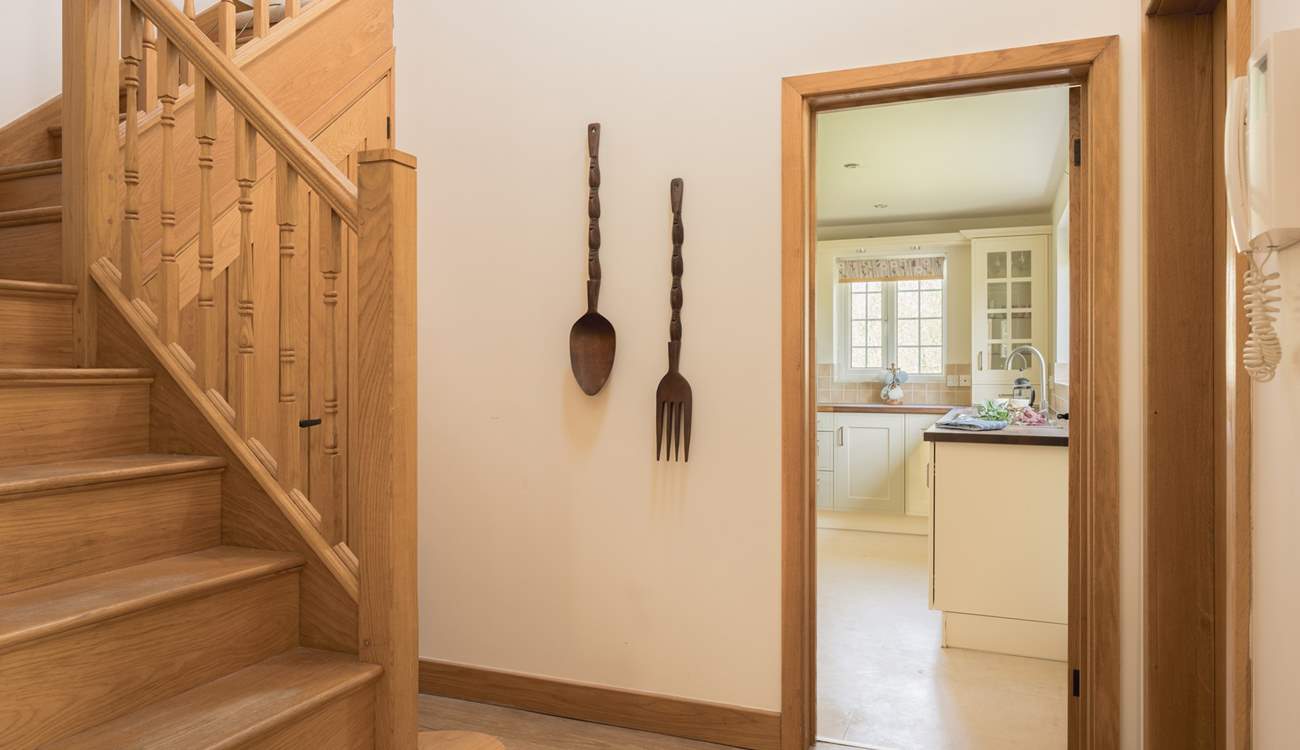 Admire the wooden staircase on the way through to the kitchen.