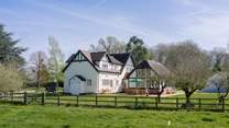 Welcome to The Woodlands, a spacious property nestled in two acres of garden.