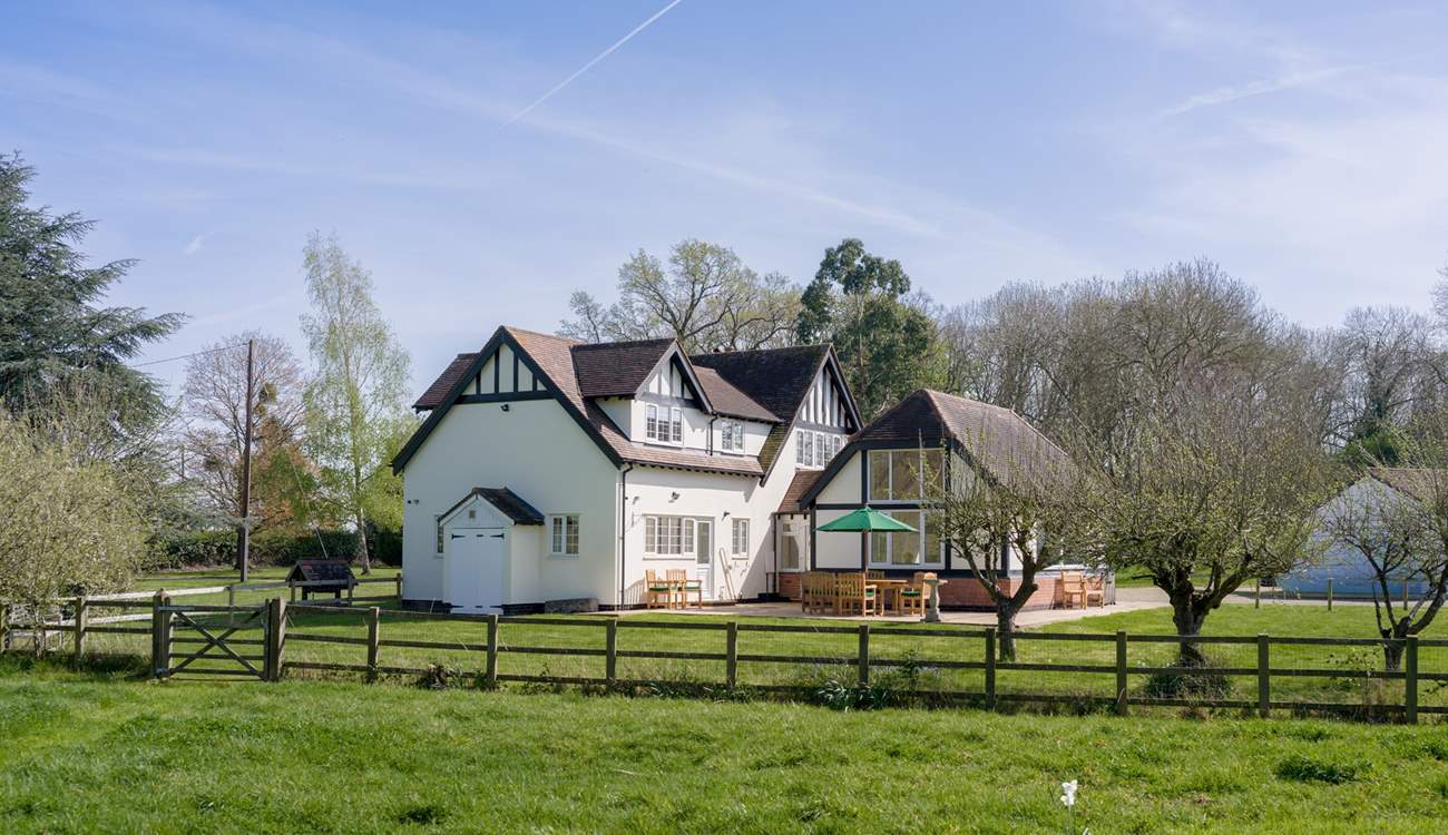Welcome to The Woodlands, a spacious property nestled in two acres of garden.
