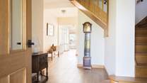 This spacious hallway lets the light flood in.