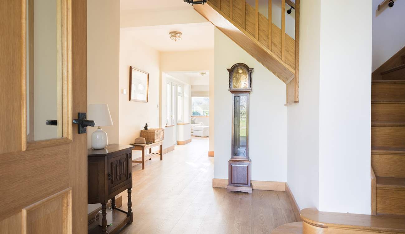 This spacious hallway lets the light flood in.