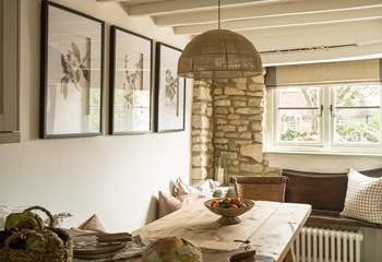 The original stone walls and beams give a nod to the age of this gorgeous cottage. 