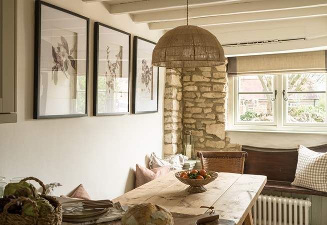 The original stone walls and beams give a nod to the age of this gorgeous cottage. 