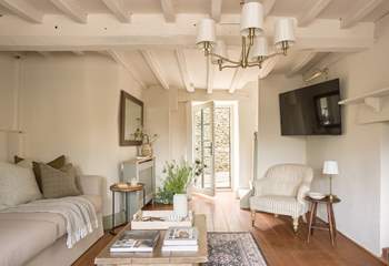 The door opens out onto the small courtyard with summer-house.