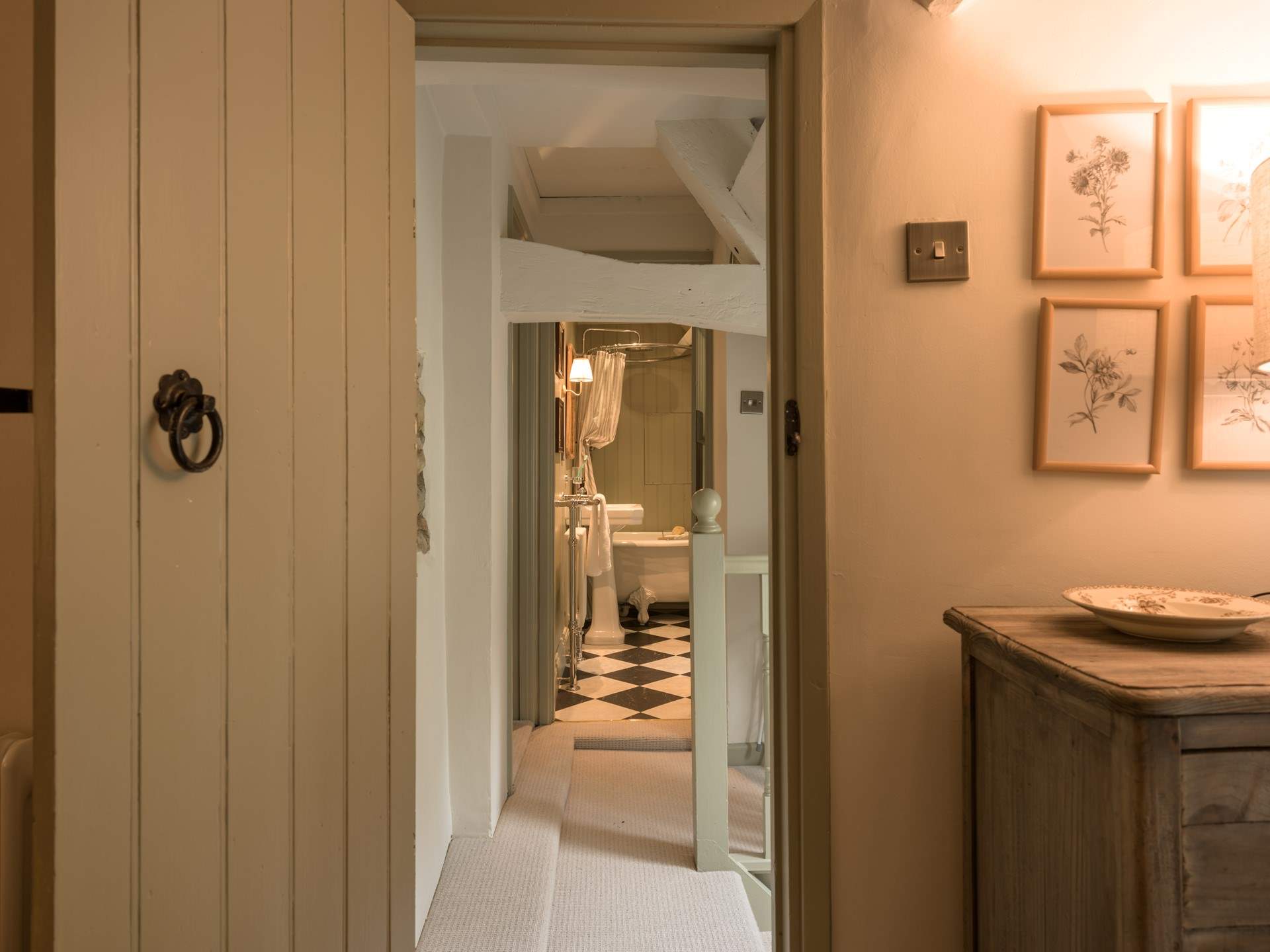 Just across the hallway is the stylish bathroom.