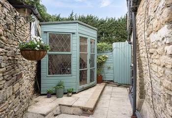 Th rear courtyard is very private with a summer-house and room to sit out in the sunshine.