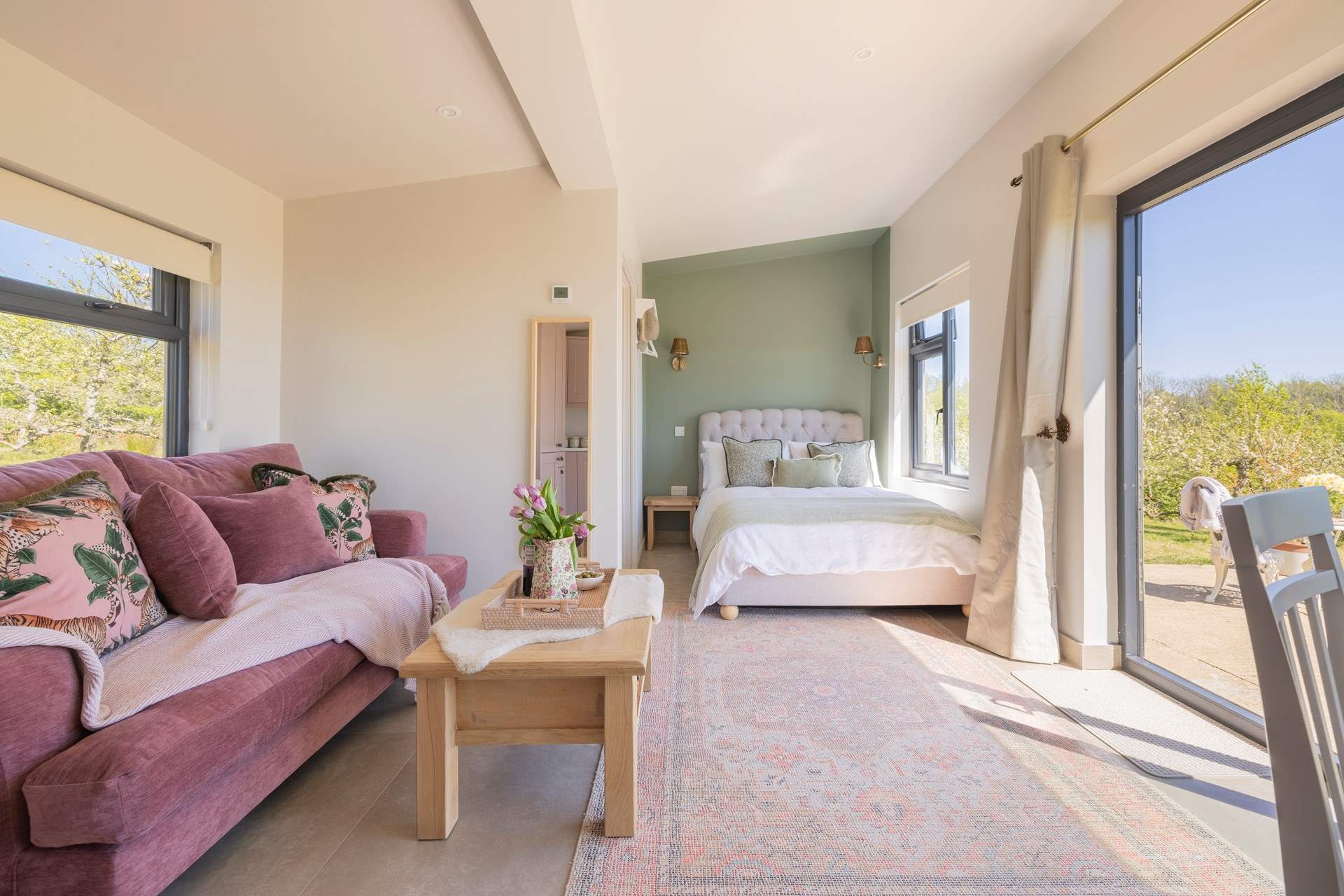 The open plan living area with a wonderfully comfy sofa and double bed.