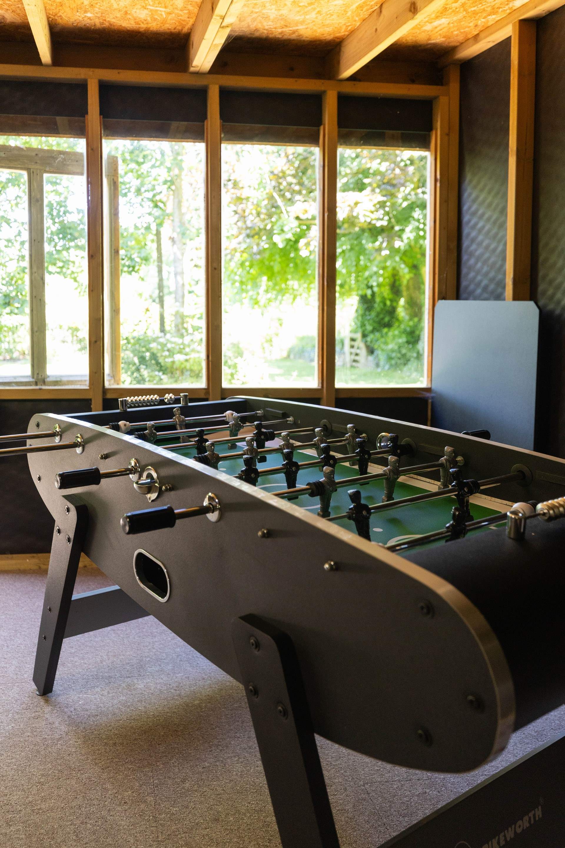 Play a game of table-football in the shared games-room. 