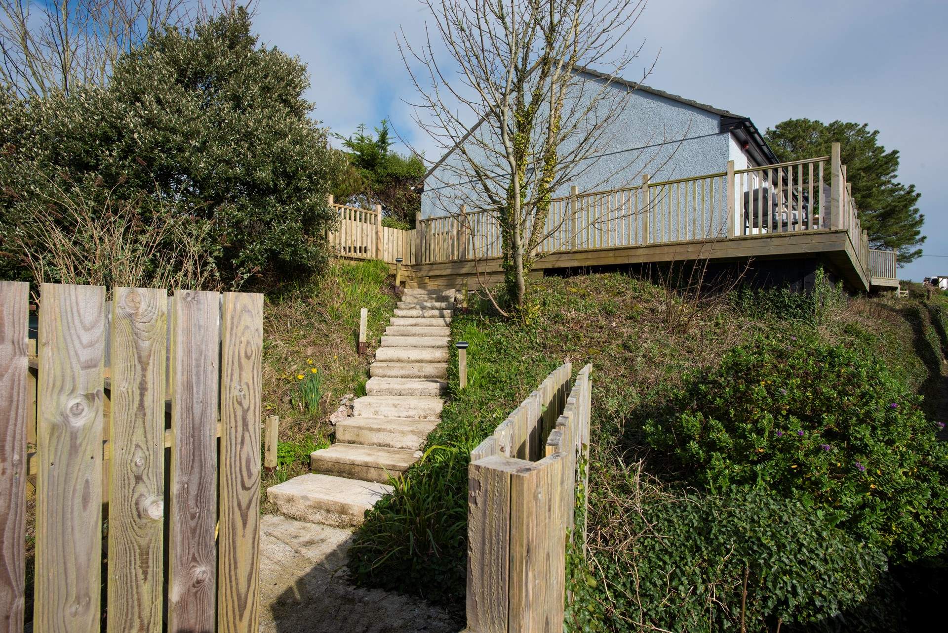 Take the steps that lead up to Bramble Cottage.