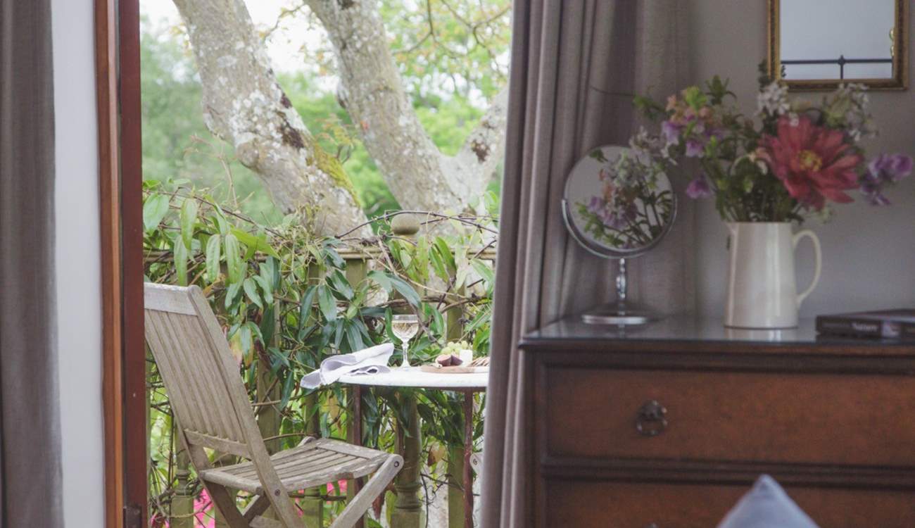 Step outside of the first floor sitting and bedroom area onto this delightful balcony space.