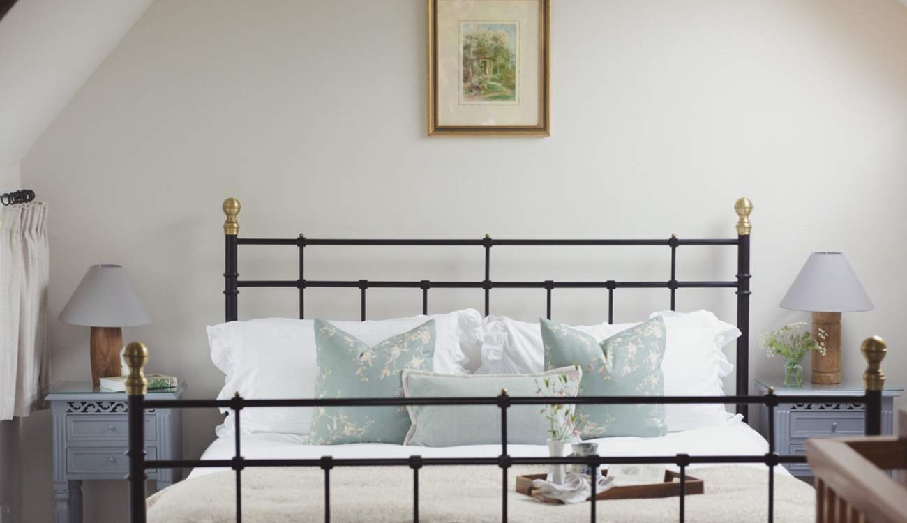 Retiring to bed is a treat in this super inviting king-size bed.