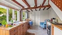The kitchen is compact yet offers ample food preparation space.