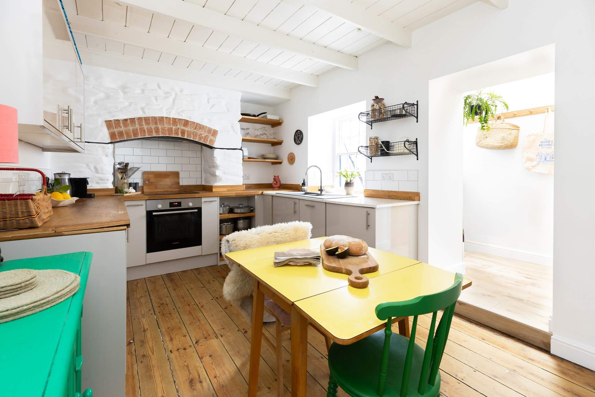 The kitchen leads to the wet-room and back door to the courtyard. 