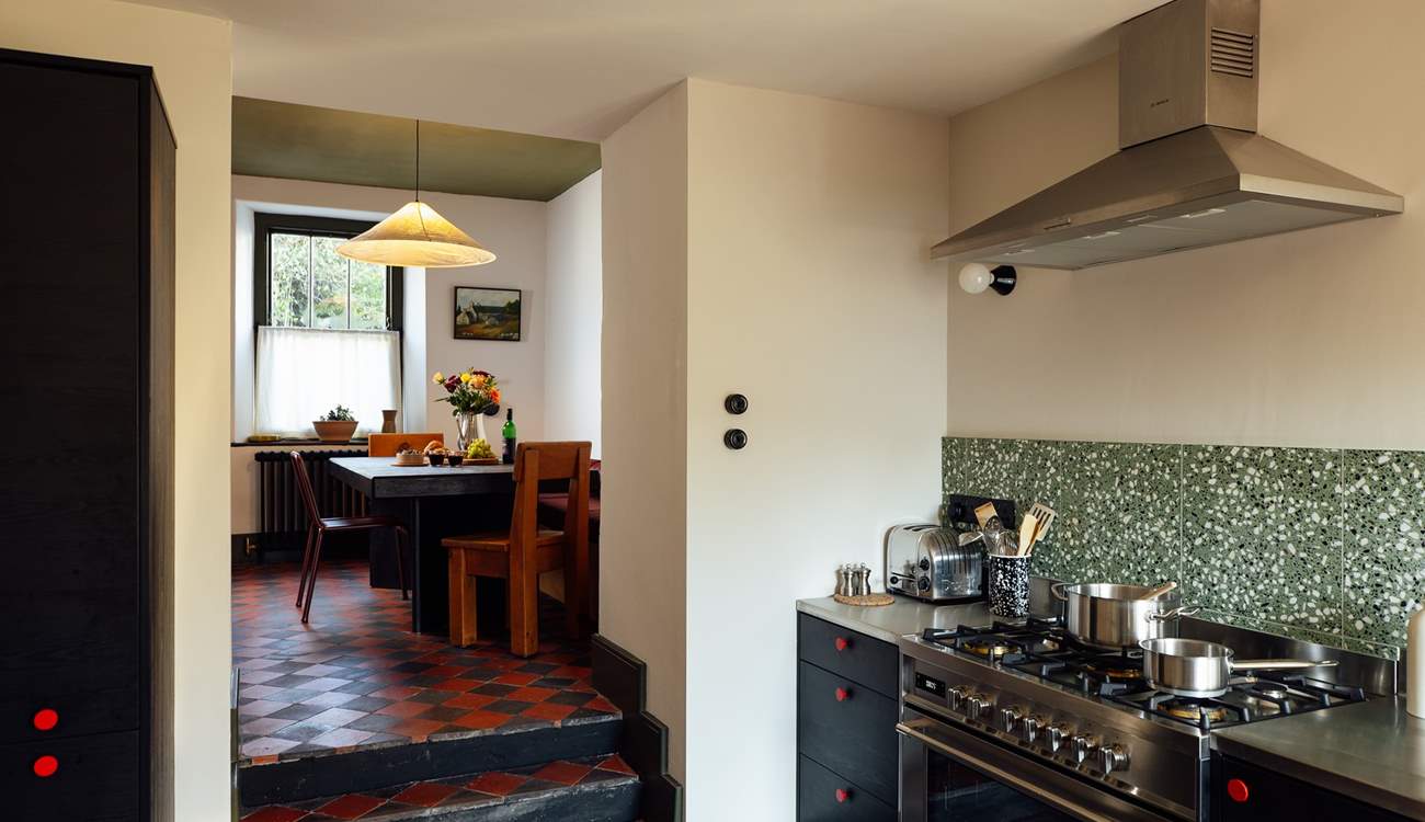 The open plan kitchen and dining-room are perfect for get togethers. 