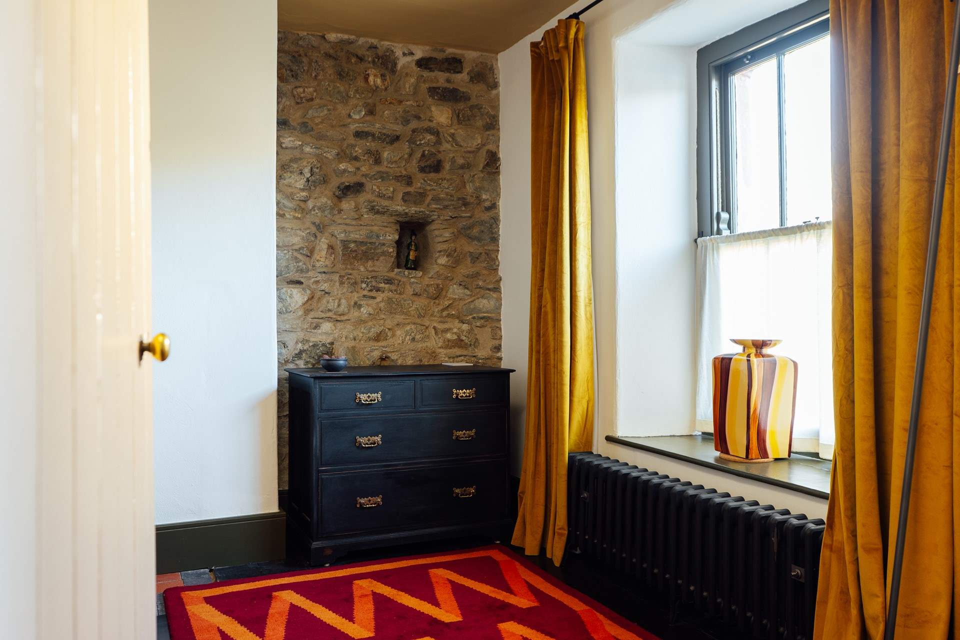 Throughout, the cottage is adorned with stylish furnishings. Bedroom 1, a double front facing room.