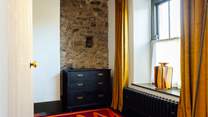Throughout, the cottage is adorned with stylish furnishings. Bedroom 1, a double front facing room.
